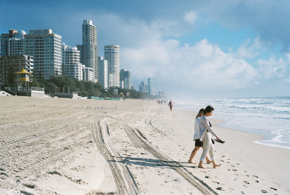 A couple walking at the Gold Coast Beach in Gold Coast, Australia